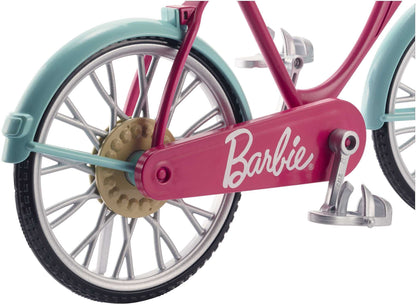 Barbie bicycle with a basket of colorful flowers, showcasing a pink frame and stylish design for outdoor fun.