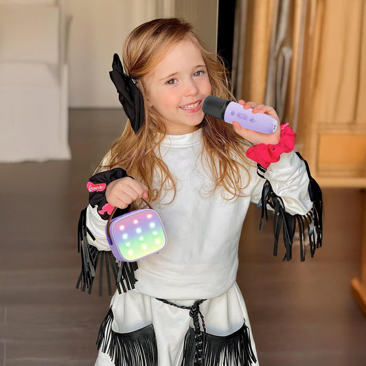 YLL mini karaoke machine in purple with two wireless microphones, ideal for kids' parties and birthday gifts for ages 3 to 12.