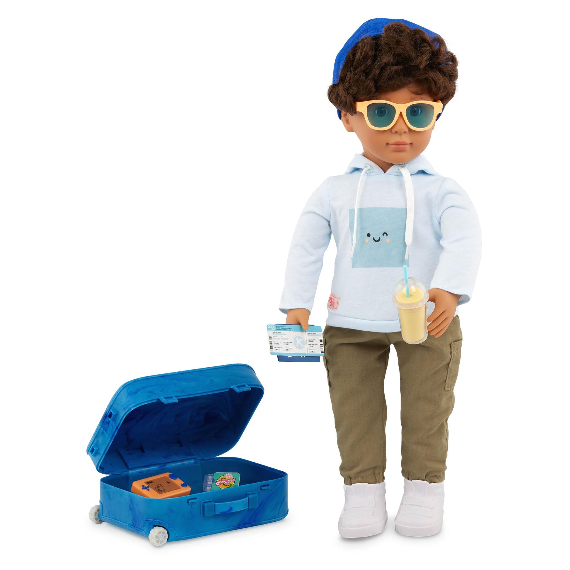 Our Generation Milo boy doll with travel accessories including passport, luggage, and sunglasses, ideal for imaginative play.