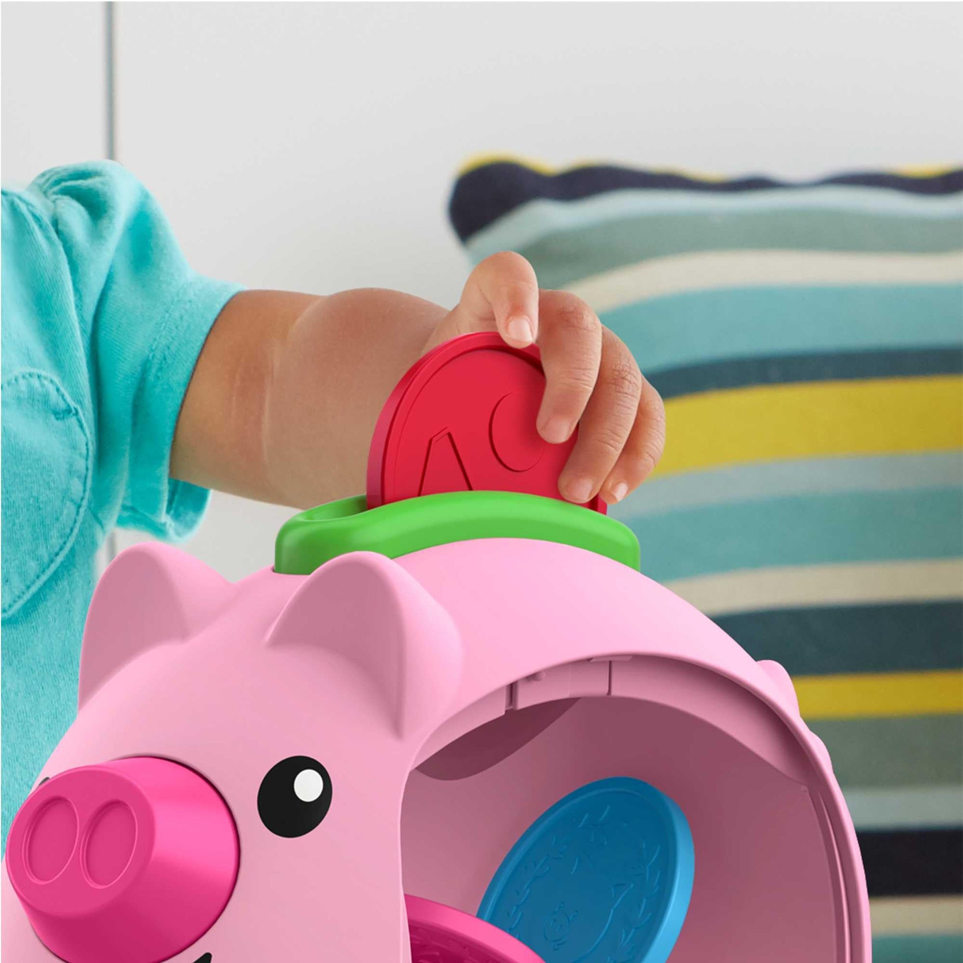 Fisher-Price Laugh & Learn Count & Rumble Piggy Bank toy with musical features and fun motion for babies and young children.