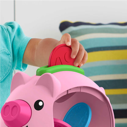Fisher-Price Laugh & Learn Count & Rumble Piggy Bank toy with musical features and fun motion for babies and young children.