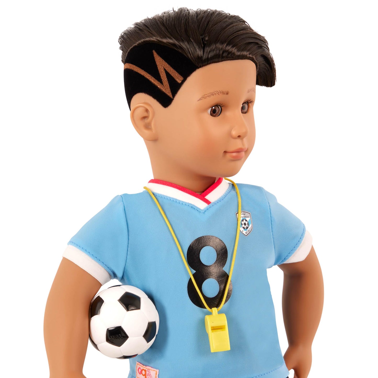Our Generation Mateo boy doll with unique hairstyle, wearing a football jersey and training accessories, 18-inch soft toy figure.