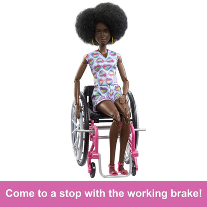 Barbie Fashionistas doll in a rainbow heart romper, with curly black hair, wheelchair, and ramp for kids' imaginative play.