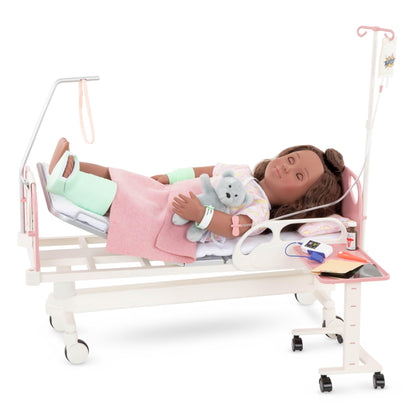 Our Generation doll hospital bed set with medical kit, stethoscope, and gown for 18-inch dolls, ideal for imaginative play.