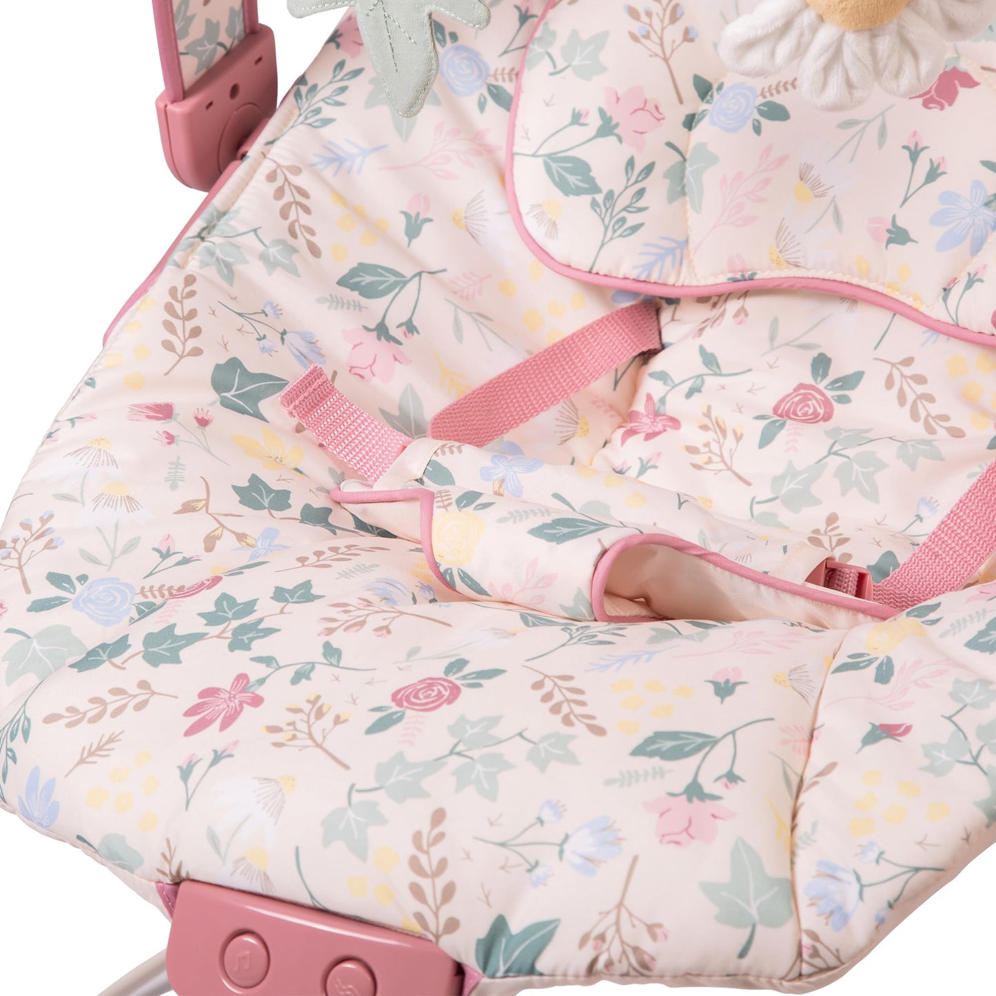 Red Kite Cozy Bounce musical baby bouncer in rose and ivy colors with padded seat and hanging toys for infant comfort.