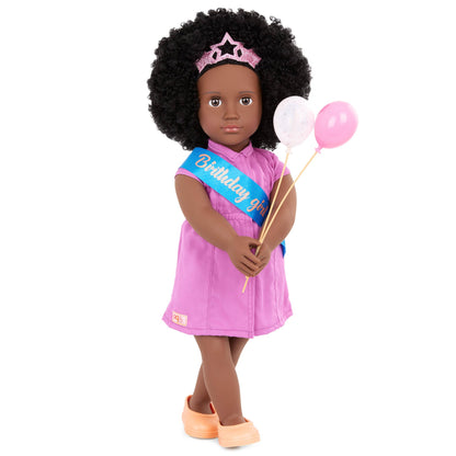 Our Generation 18-inch Khelani doll with birthday party accessories, featuring a festive outfit and fun decorations.