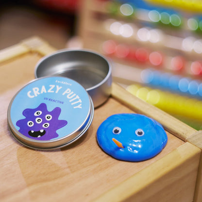 Color-changing putty in lid pots with mini UV torches, sensory slime toy by THE TWIDDLERS, perfect for kids' DIY art and calming activities.