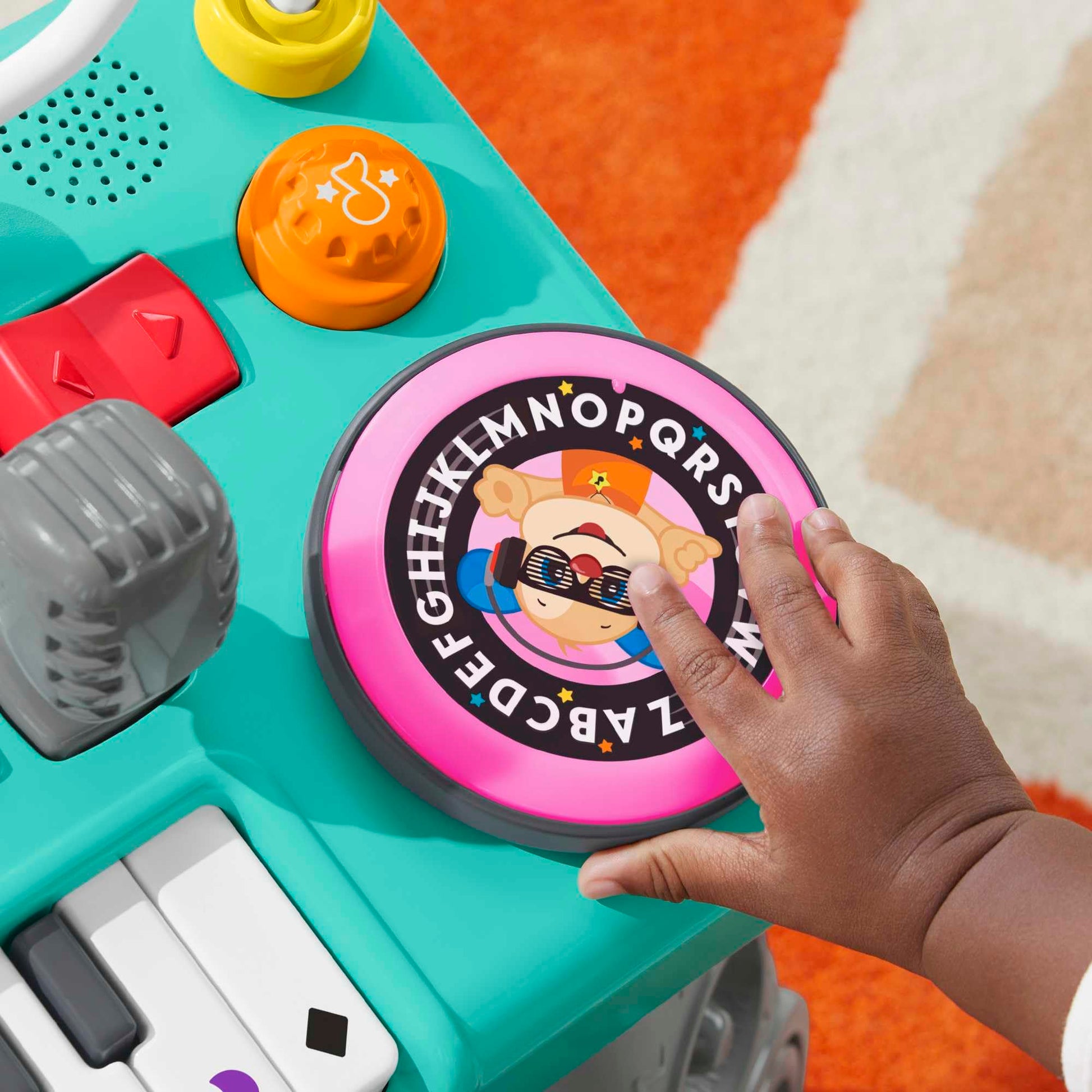 Fisher-Price Laugh & Learn Mix & Learn DJ Table for babies and toddlers with colorful lights, sounds, and musical learning features.