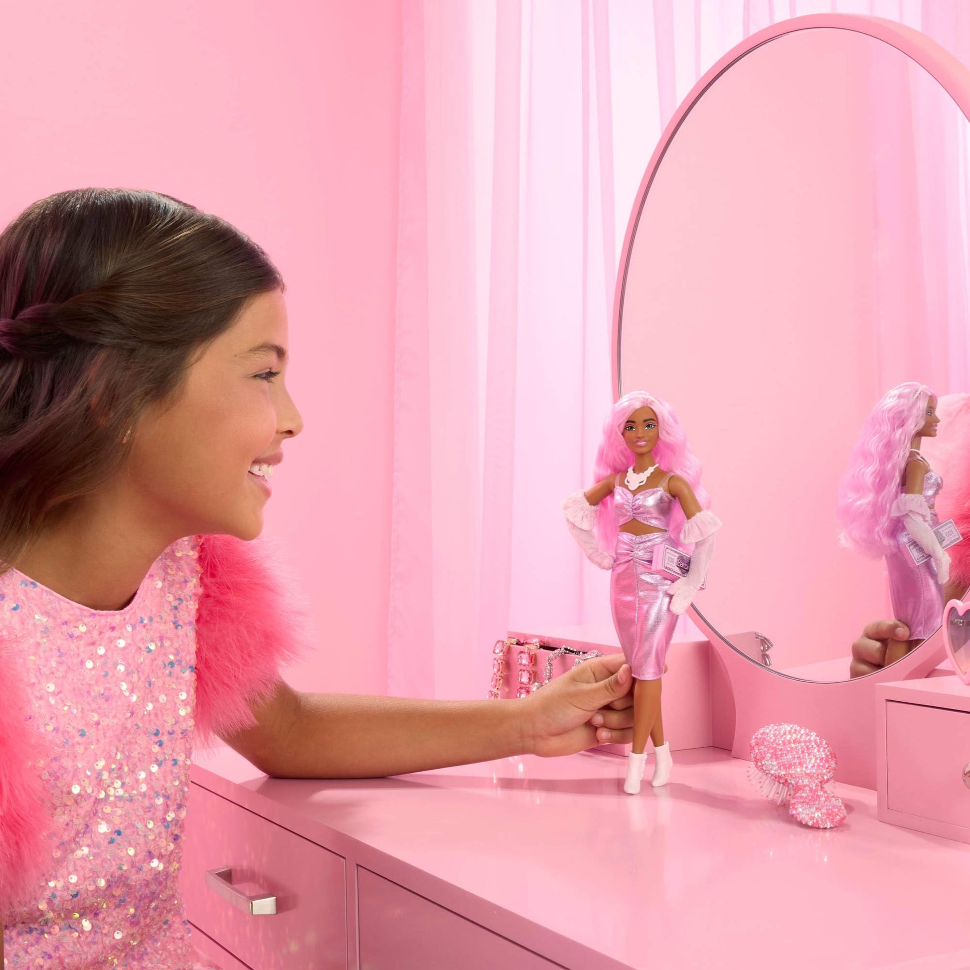 Barbie Deluxe Style Doll #1 in pink dress, pink hair, and accessories like velvet gloves and money purse.