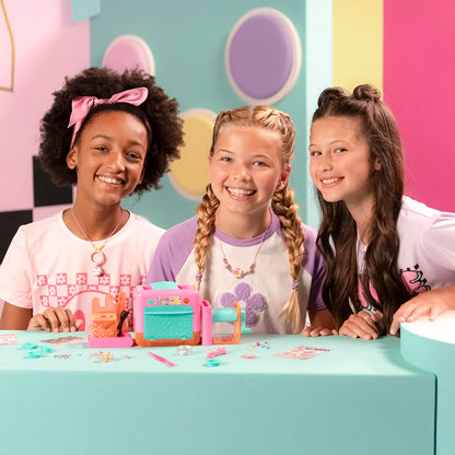 Canal Toys Style 4 Ever Magic Clay Jewellery Factory kit showing colorful clay rings, bracelets, and charms with making accessories.