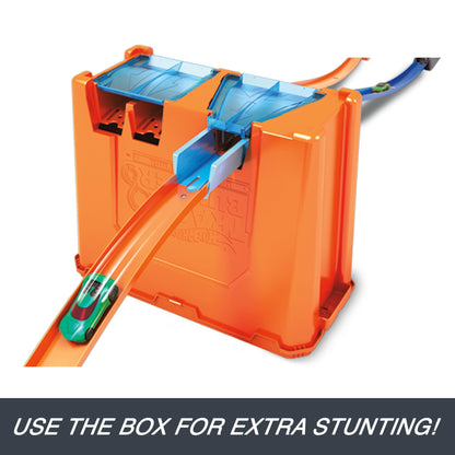Hot Wheels Track Builder Deluxe Stunt Box with dual launchers, 5 meters of track, and 2 toy cars for ages 6 and up.