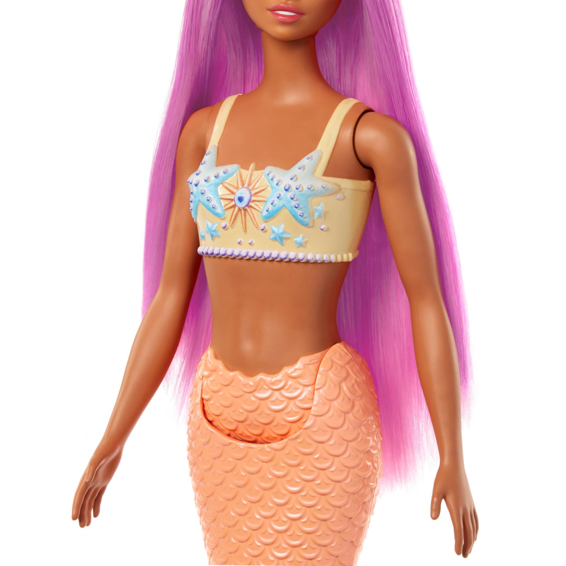Barbie mermaid doll with pink hair, starfish bodice, and soft orange tail, wearing a matching headband accessory.