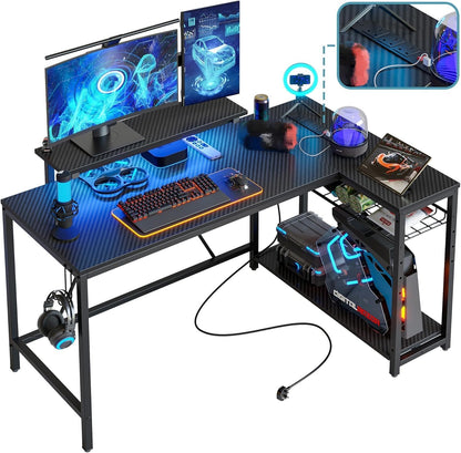 Bestier 132.5cm L-shaped home office workstation with carbon fibre surface, shelves, hooks, LED lights, and built-in power outlets.