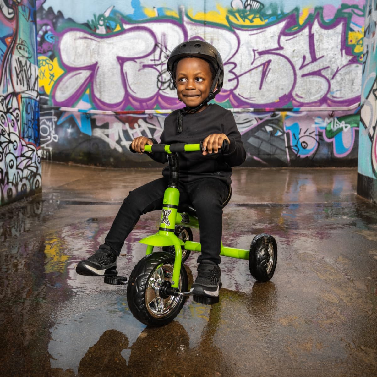 Xootz tricycle for kids with easy clip design, showcasing bright colors and portable features for outdoor fun.