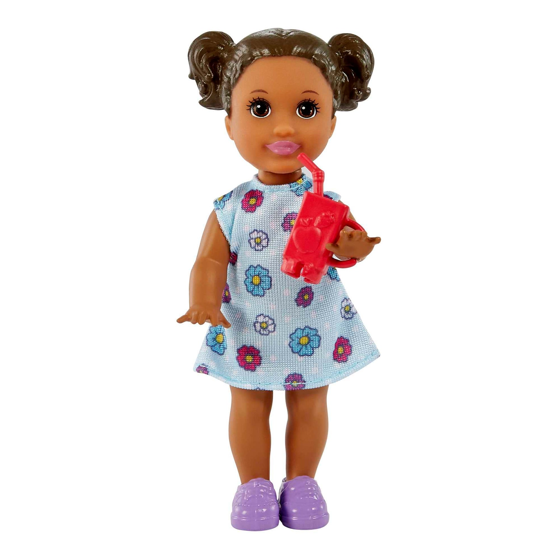 Barbie Teacher Doll with blonde hair, toddler doll with brunette hair, flip board, laptop, backpack, toddler desk, and pet turtle.