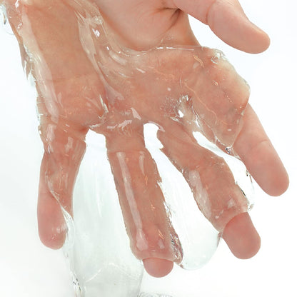 Clear Crazy Aaron's Thinking Putty Liquid Glass in a 4-inch tin, showcasing its see-through, glossy, and stretchy putty for stress relief and play.