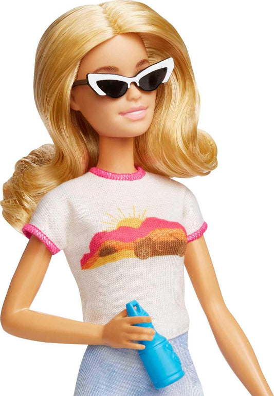Barbie Malibu doll with blonde hair in a travel set, including puppy and suitcase, showcasing 10+ accessories.