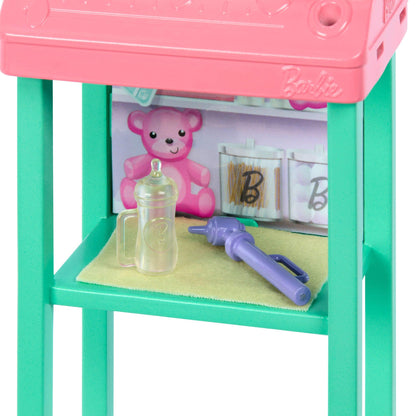 Barbie Baby Doctor doll with blonde hair in pink scrubs, includes baby accessories and furniture for imaginative play