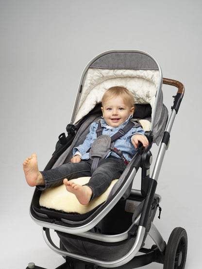 Naturally Sheepskins Merino pram liner with natural New Zealand sheepskin and cotton backing, breathable, temperature-regulating for strollers.