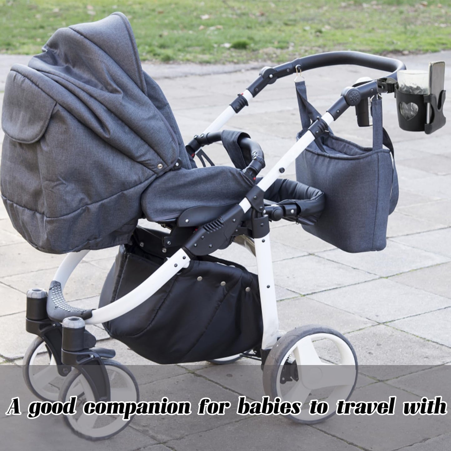 Black BAGUBDR pram cup holder with phone holder and coffee holder attached to a pushchair or stroller.