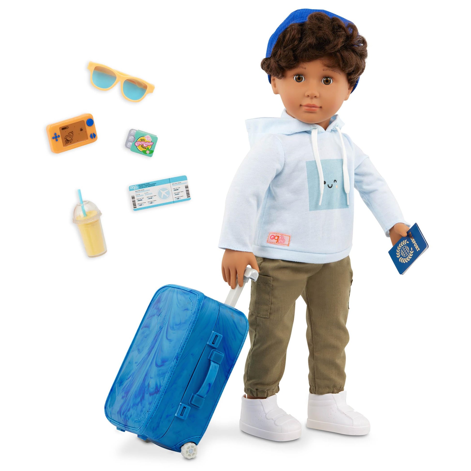 18-inch Our Generation Milo boy doll with travel accessories including passport, luggage, and sunglasses for realistic play.