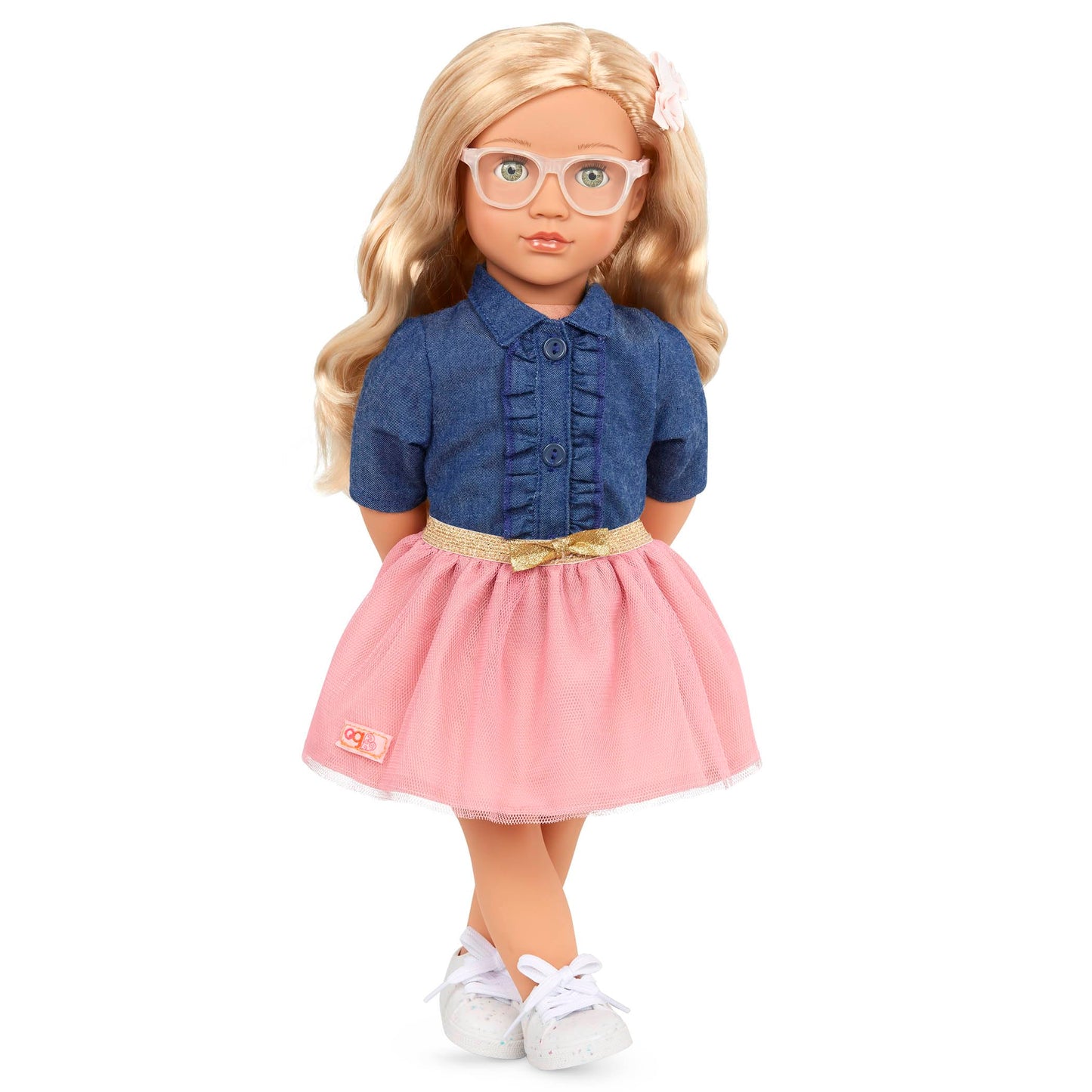 18-inch Our Generation Emily girl doll in pink dress and denim top, featuring stylish glasses and a huggable soft body.