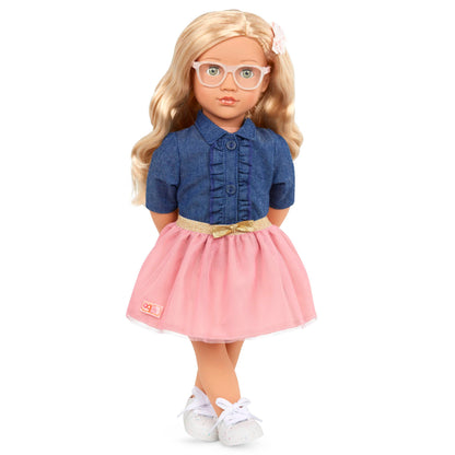 18-inch Our Generation Emily girl doll in pink dress and denim top, featuring stylish glasses and a huggable soft body.
