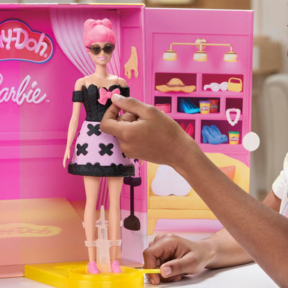 Play-Doh Barbie Designer Fashion Show Playset with colorful molds and Barbie figures in a creative setup.