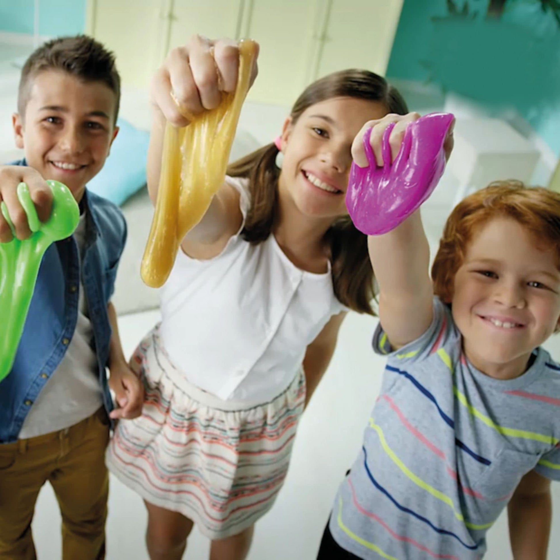 Colorful Slimy Ultimate Bucket Fun set with multiple slime containers and playful accessories in a vibrant package.