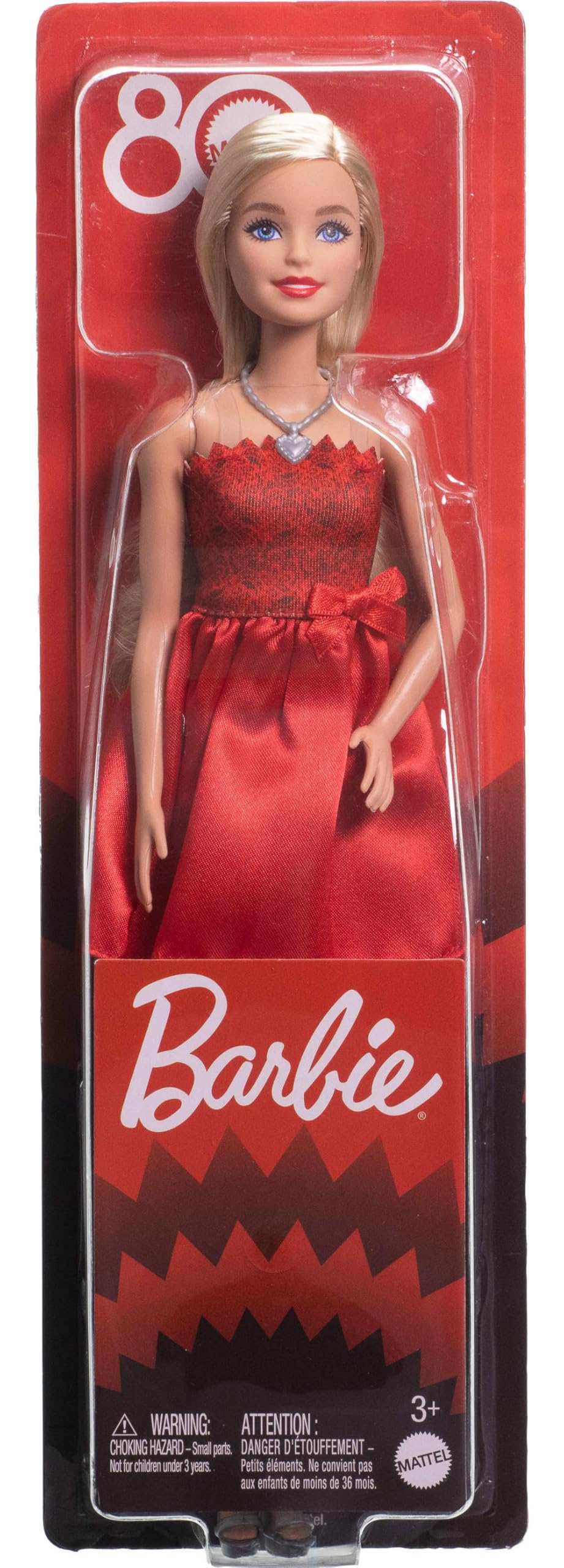 Barbie 80th Anniversary blonde doll in a ruby-red dress, silvery shoes, and necklace, showcasing her collectible fashion style.