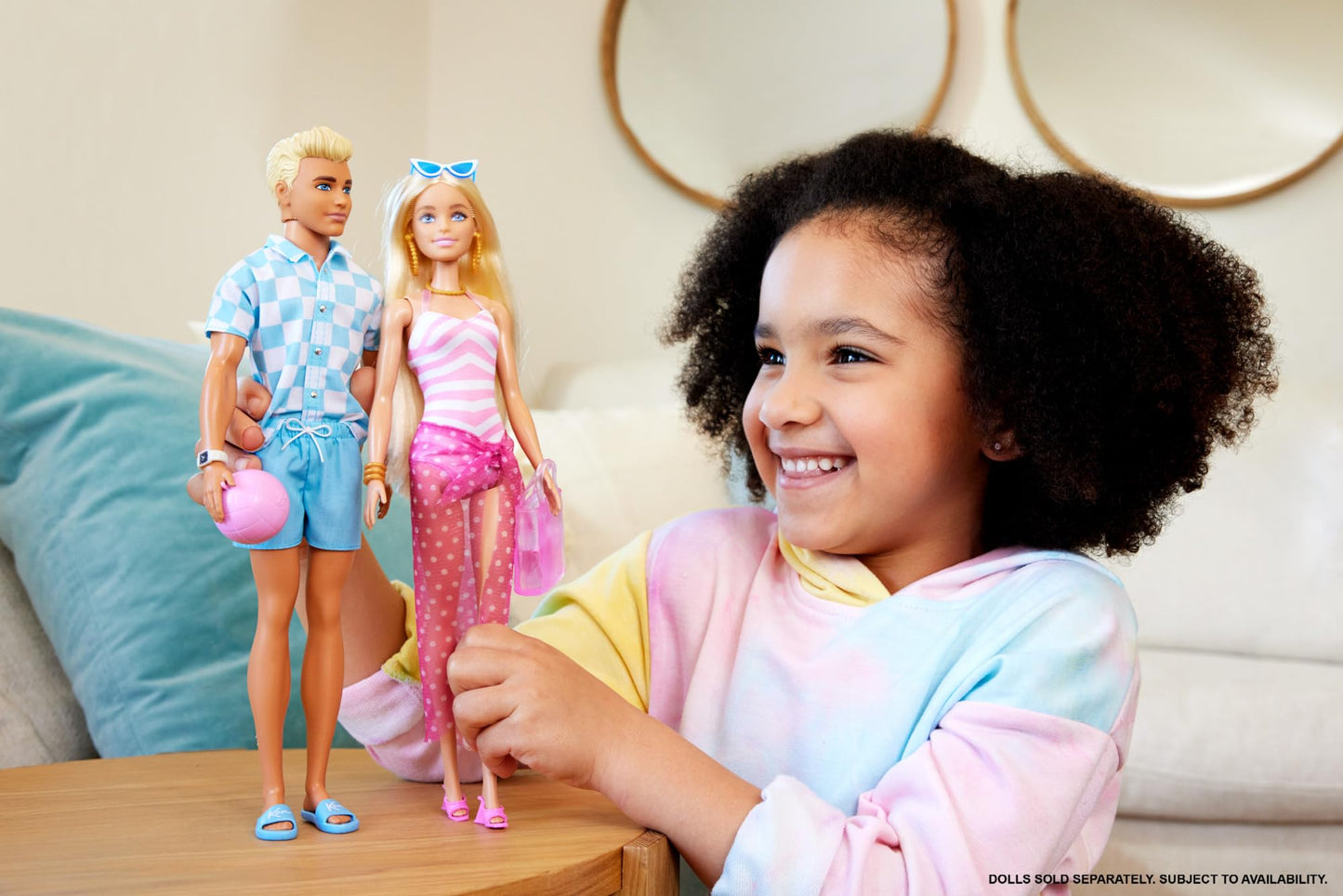 Blonde Ken doll in blue button-down shirt and swim trunks with beach towel and accessories, by Barbie.