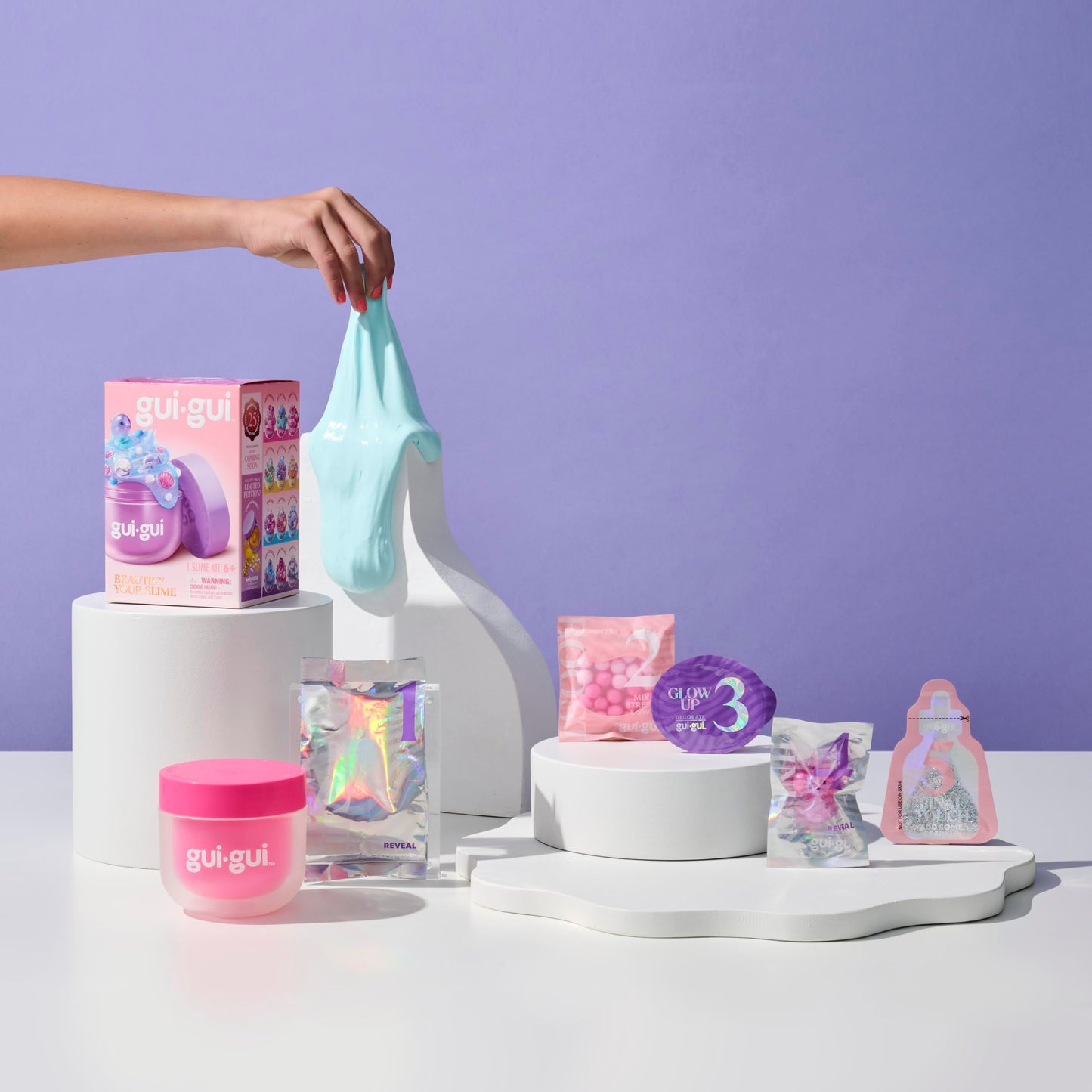 Gui Gui Gloss Slime with vibrant color, textured surface, and scented gloss finish, part of the collection of 13 slime varieties.