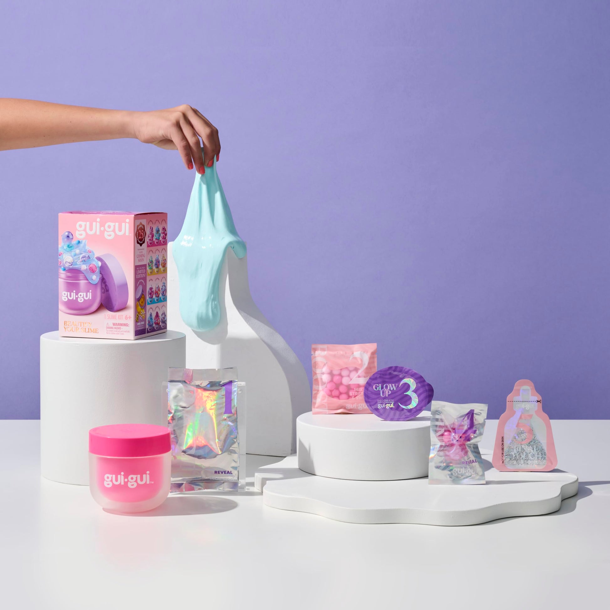 Gui Gui Gloss Slime with vibrant color, textured surface, and scented gloss finish, part of the collection of 13 slime varieties.