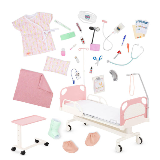 Our Generation doll hospital bed with accessories like a gown, stethoscope, and medical kit for 18-inch dolls.