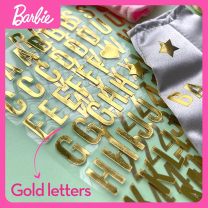 Barbie DIY Urban & Chic Fashion Designer Set with outfits, tops, leggings, stickers, and gold letters for creative play.
