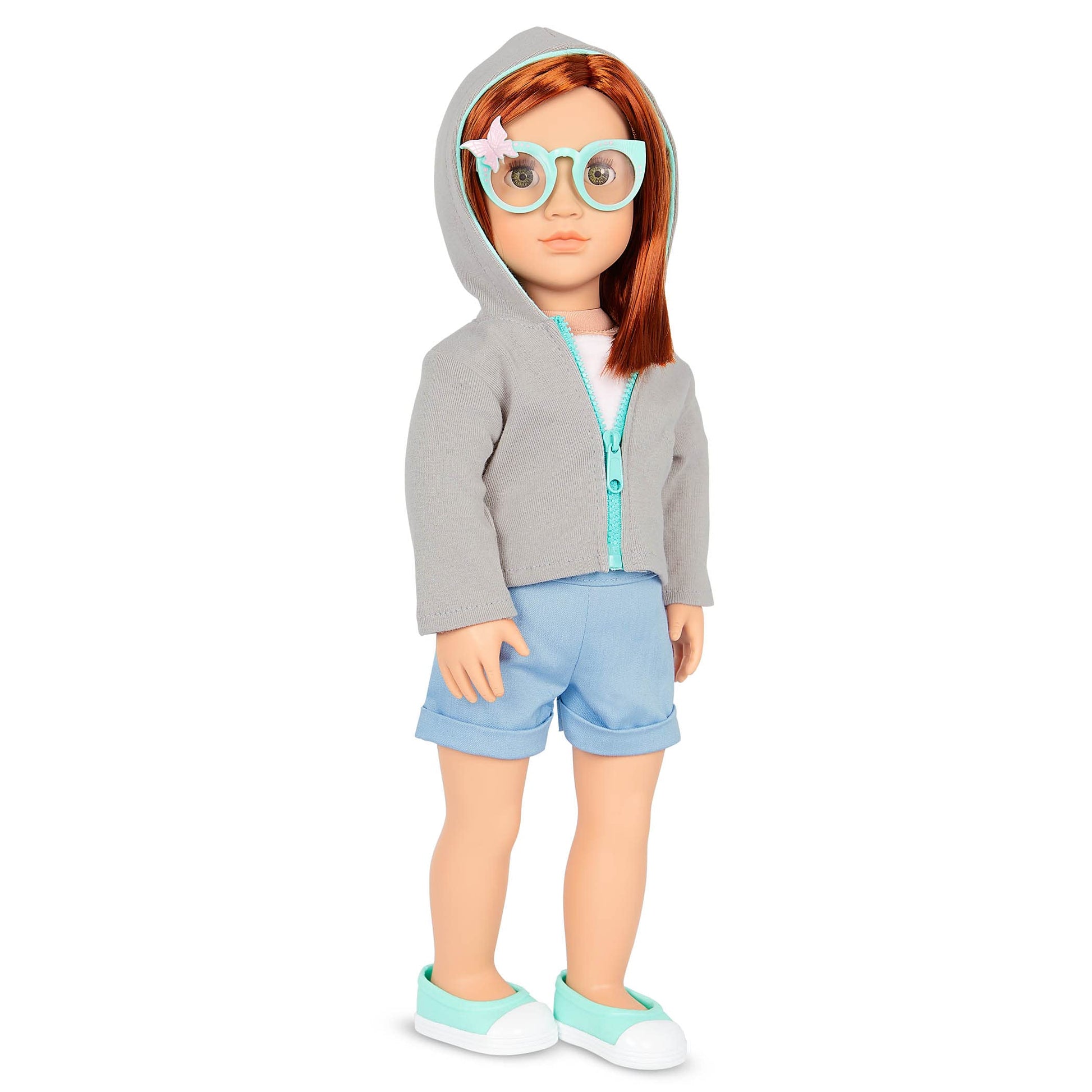 18-inch Our Generation doll Cambi with red hair, blue eyes, butterfly-themed outfits, and styling accessories in gift box.