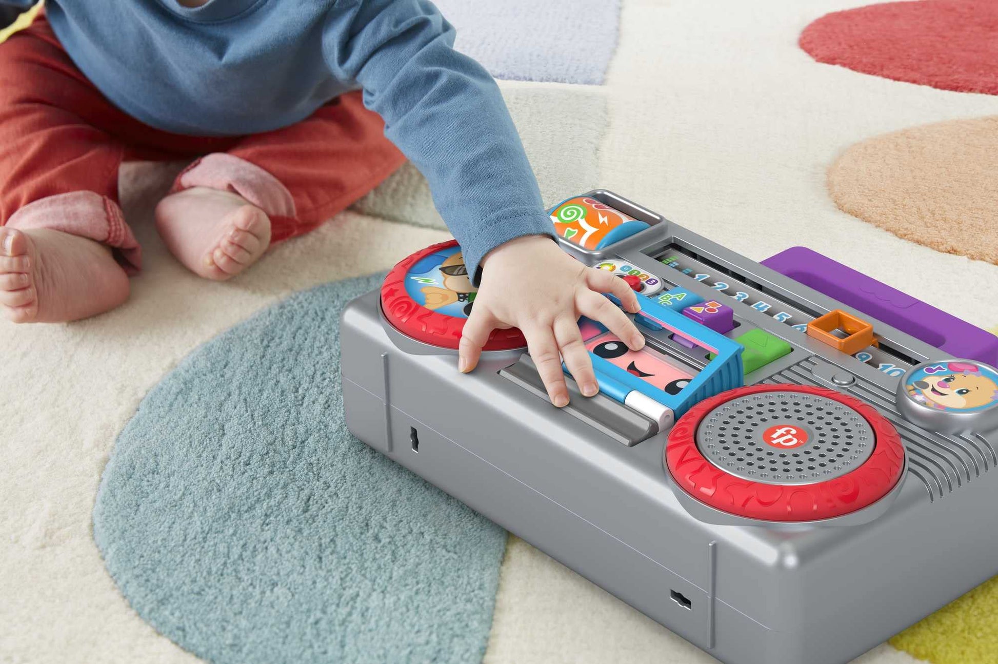 Fisher-Price Laugh & Learn Busy Boombox infant activity toy with colorful buttons and musical features for babies and toddlers.