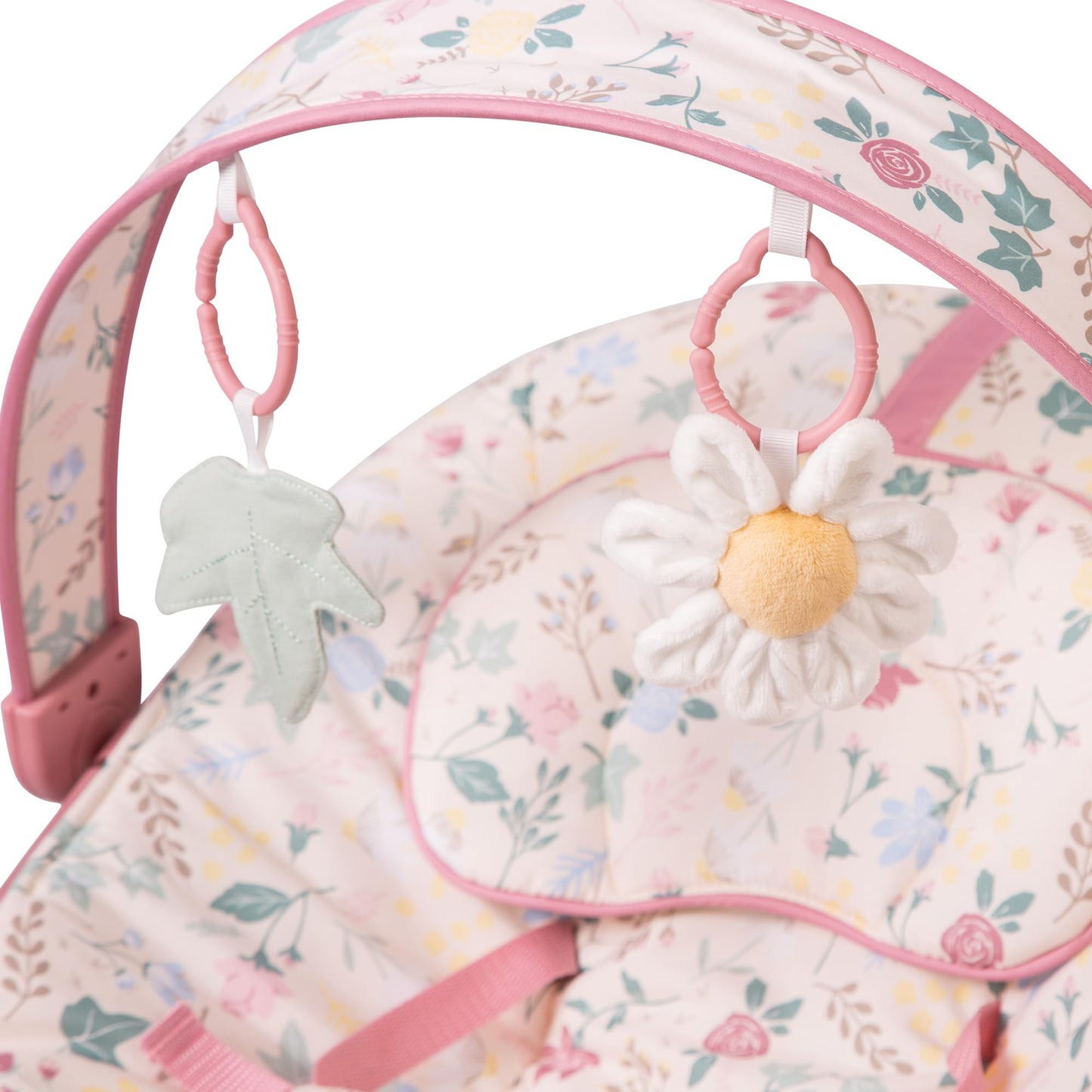 Red Kite Cozy Bounce musical baby bouncer in rose and ivy colors with soft fabric and a built-in musical toy for infants.