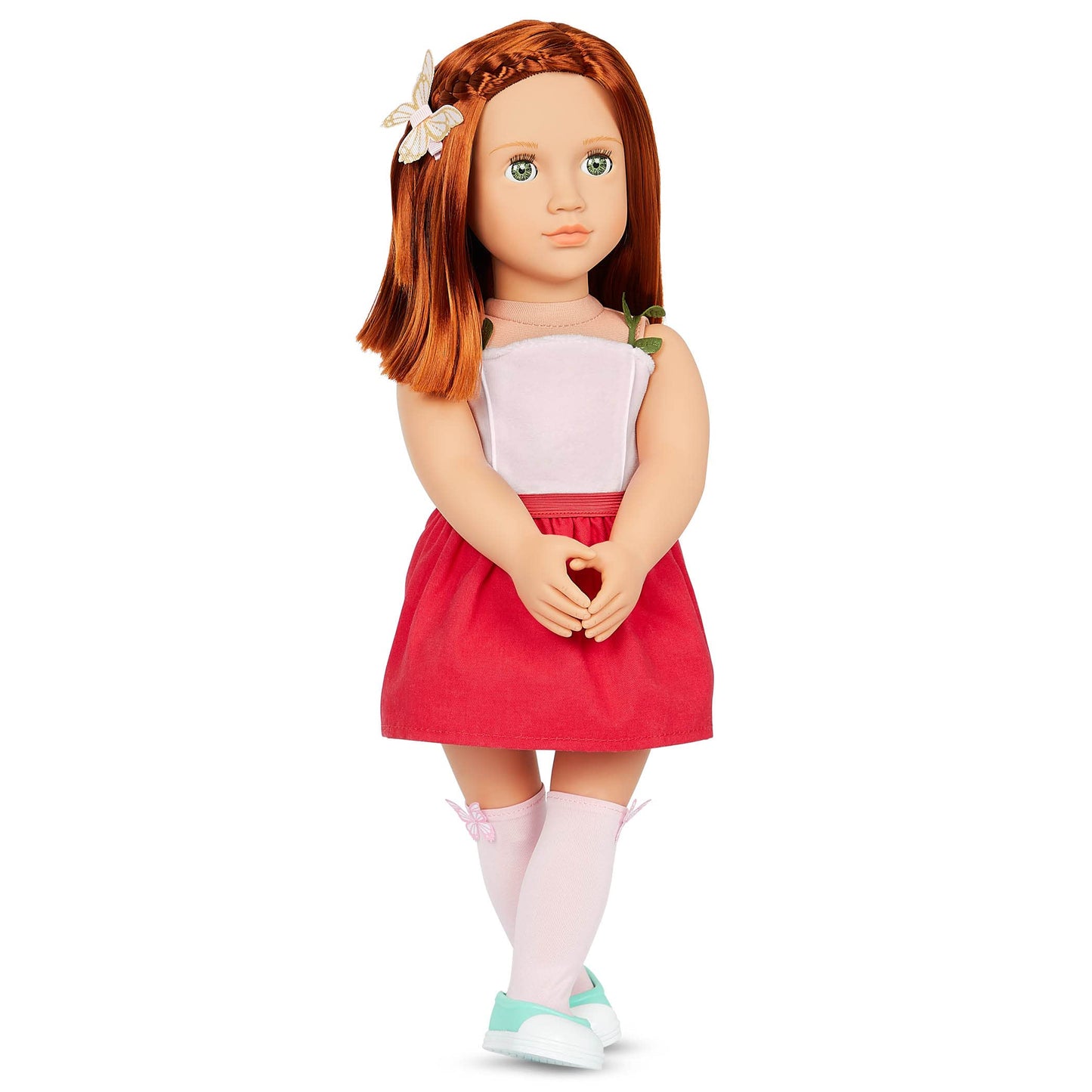 Our Generation Cambi doll with red hair and blue eyes, dressed in butterfly-themed outfits and styling accessories.