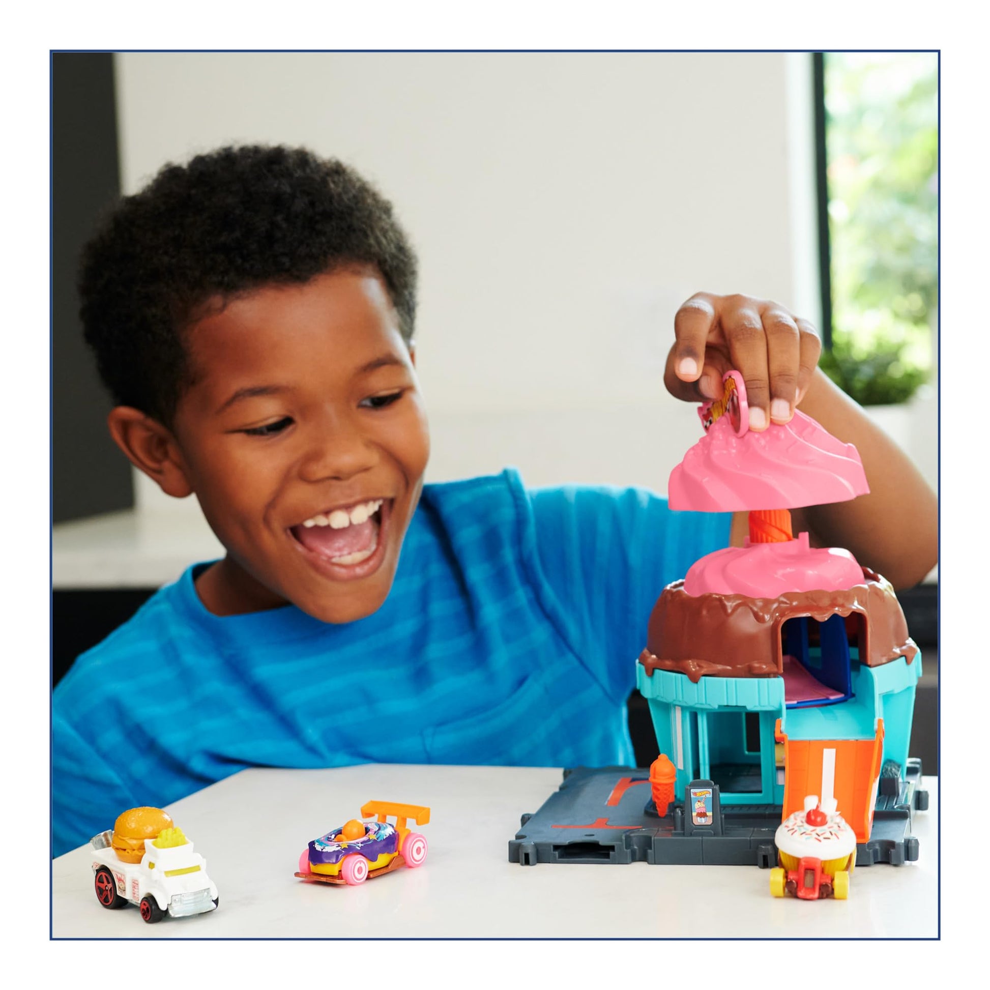 Hot Wheels Let's Race City Track Set featuring track pieces, an ice cream shop, and one included Hot Wheels car.