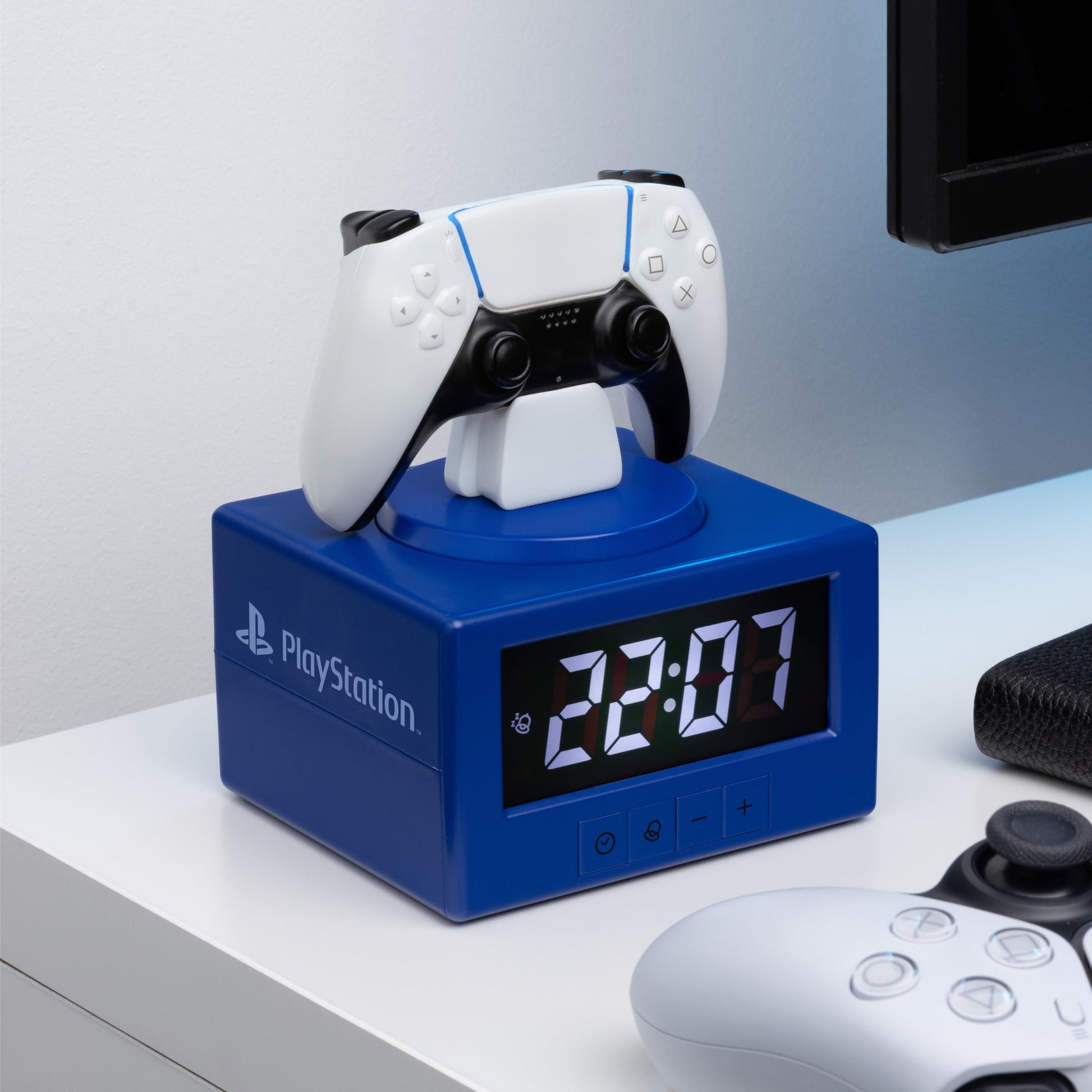 Paladone PlayStation DualSense controller digital alarm clock with night light, ideal for gaming-themed bedroom décor for kids and teens.