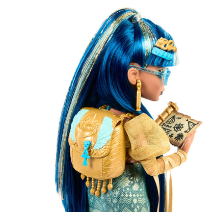 Cleo De Nile doll in golden blouse and layered skirt with pet cobra Hissette, backpack, snack, and scroll accessories.