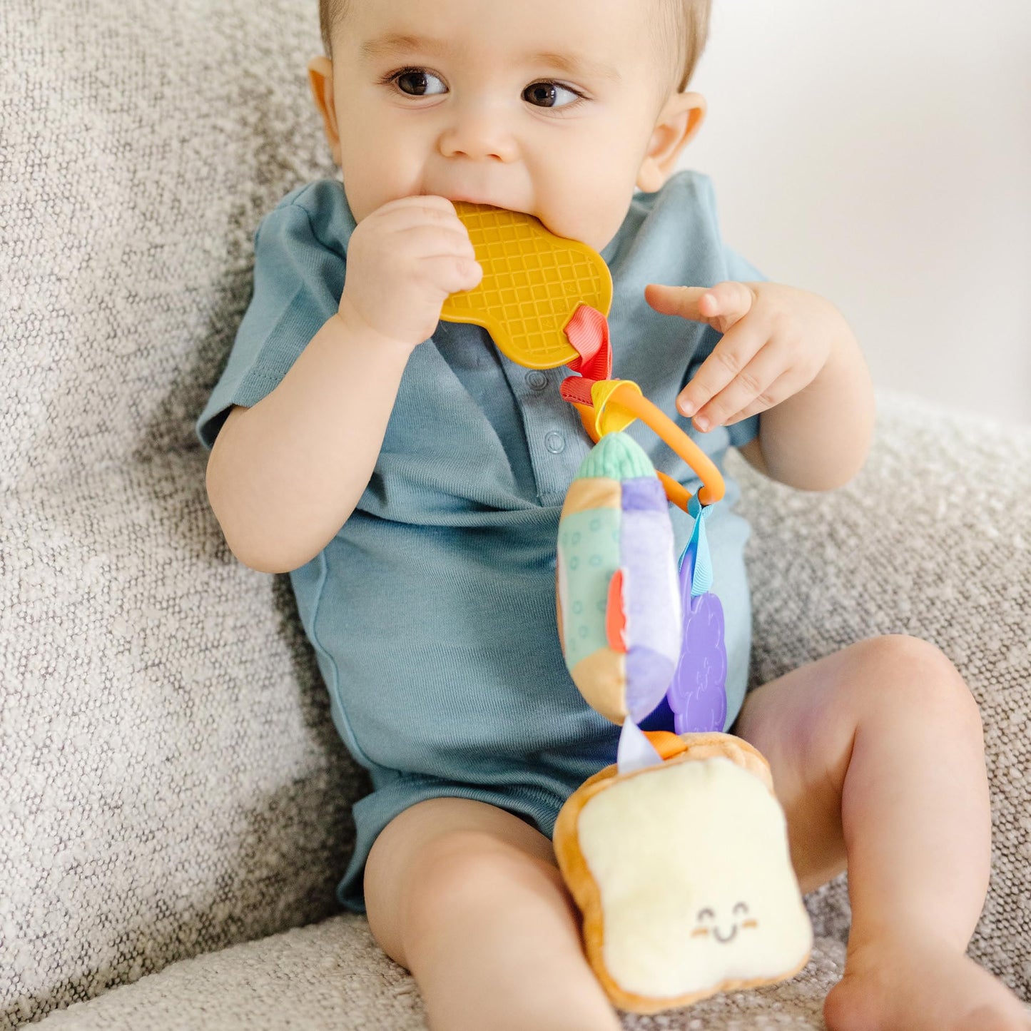 Melissa & Doug multi-sensory PB&J take-along clip-on baby toy for infants, featuring colorful textures for developmental play.