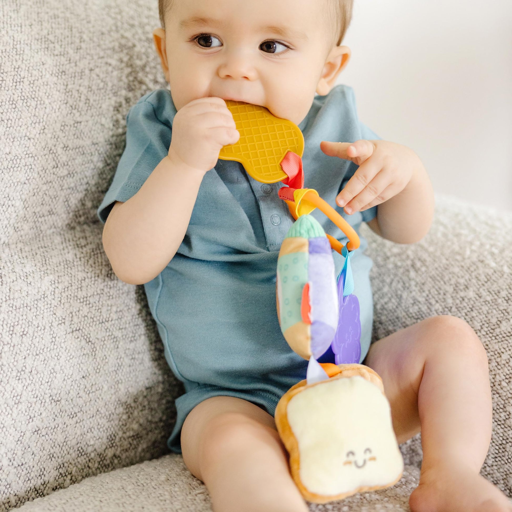Melissa & Doug multi-sensory PB&J take-along clip-on baby toy for infants, featuring colorful textures for developmental play.