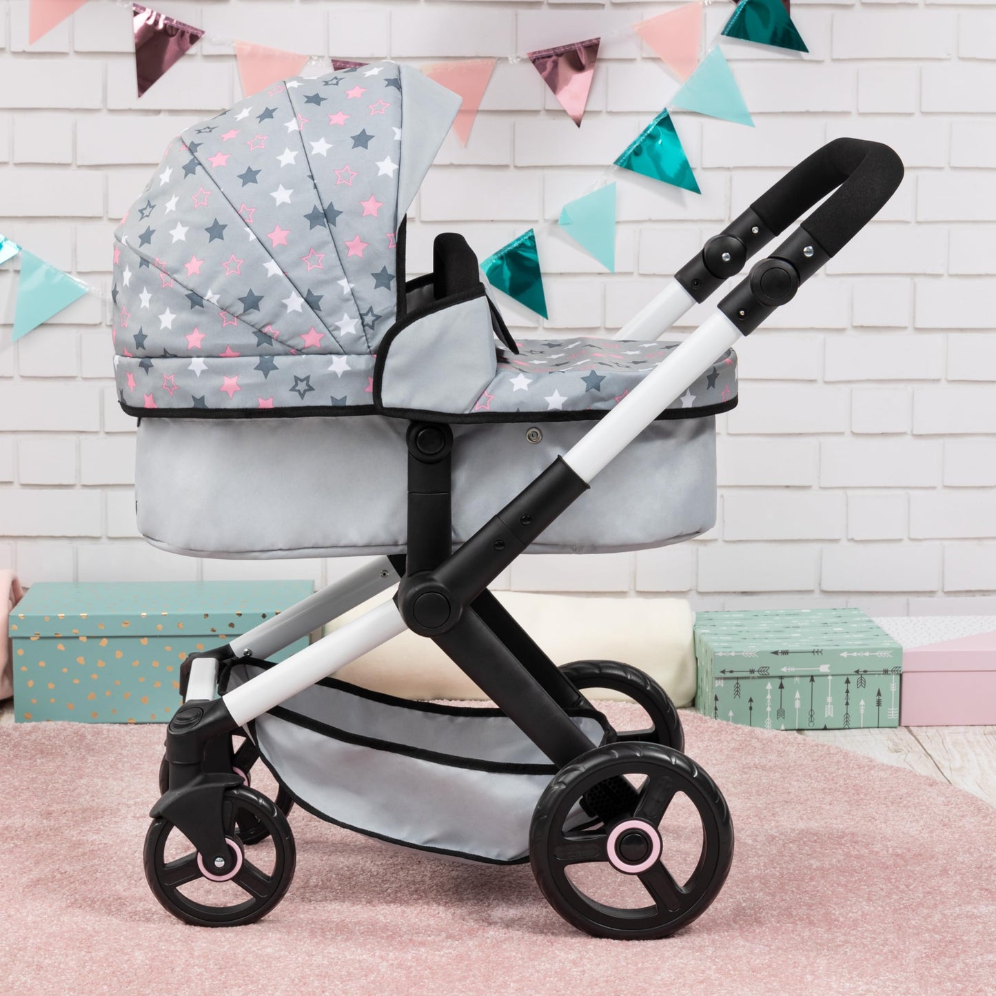 Bayer Baby Dolls Pram XEO in light grey with pink stars, convertible doll stroller with carrycot, changing bag, and adjustable handle.