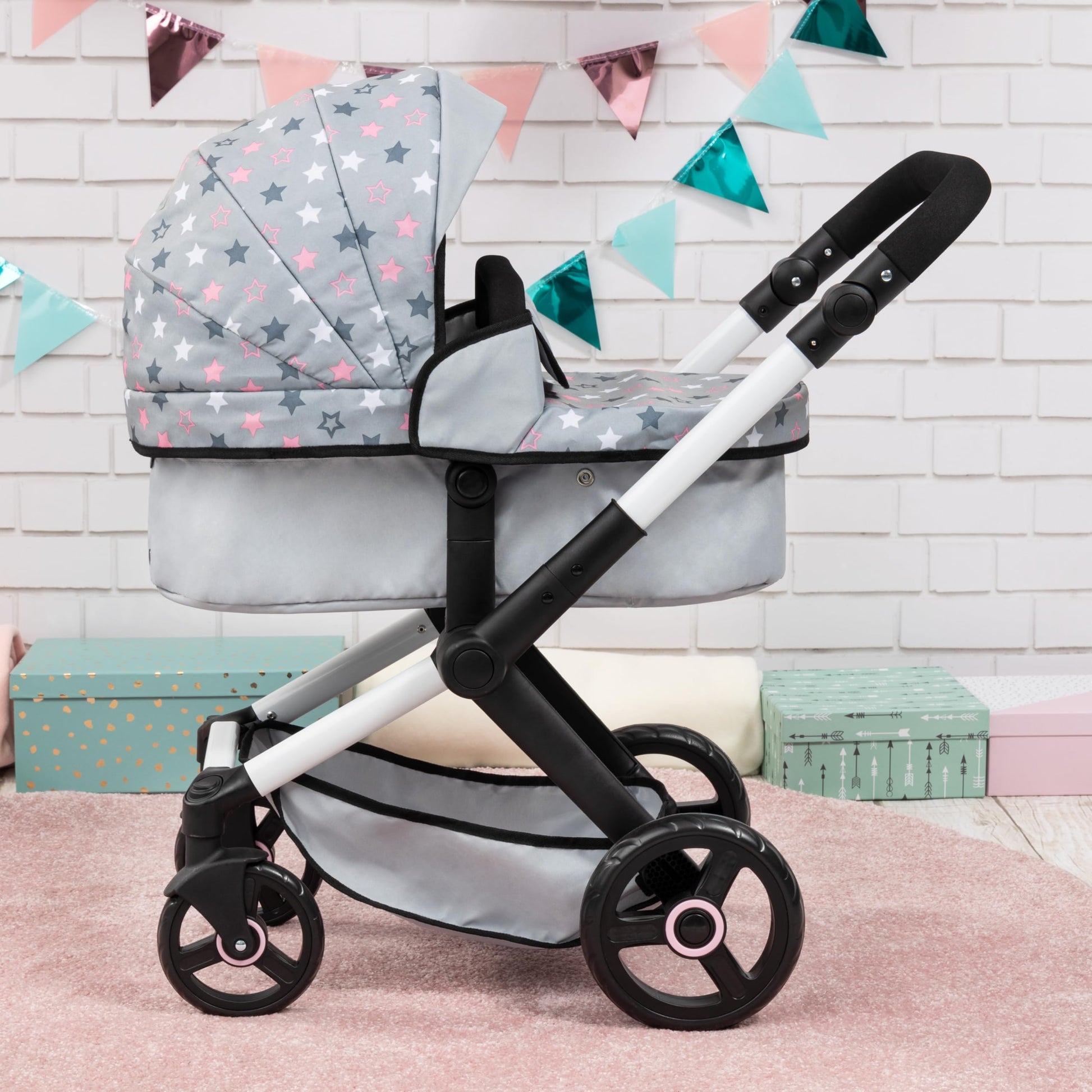Bayer Baby Dolls Pram XEO in light grey with pink stars, convertible doll stroller with carrycot, changing bag, and adjustable handle.