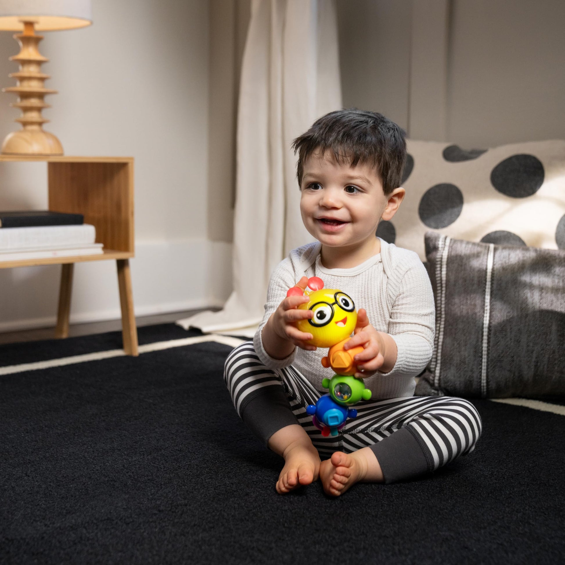 Baby Einstein Twist-a-Pal Cal sensory toy with colorful beads, musical features, designed for babies 6 months and up.