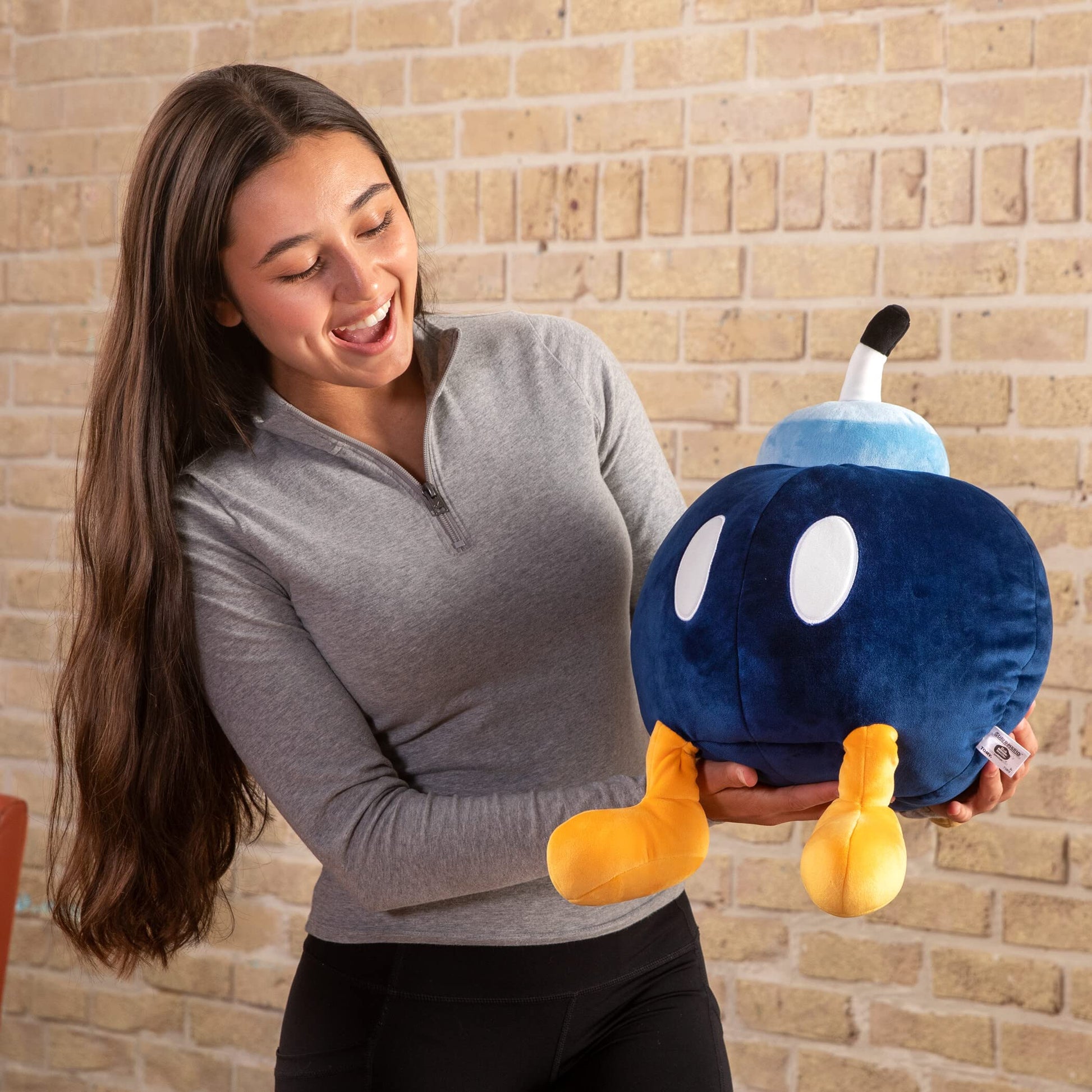 Blue TOMY Mega Bob-Omb plush toy from Nintendo, soft and huggable Club Mocchi Mocchi plush featuring a detailed Bob-Omb character.