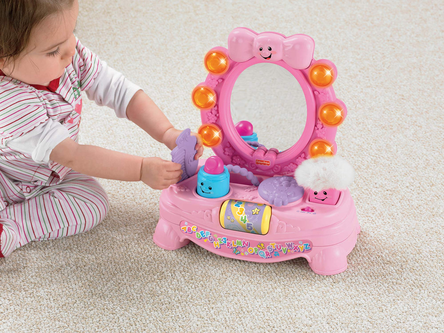 Fisher Price Laugh and Learn Magical Musical Mirror by Mattel with colorful interactive features and smiling face on the mirror.