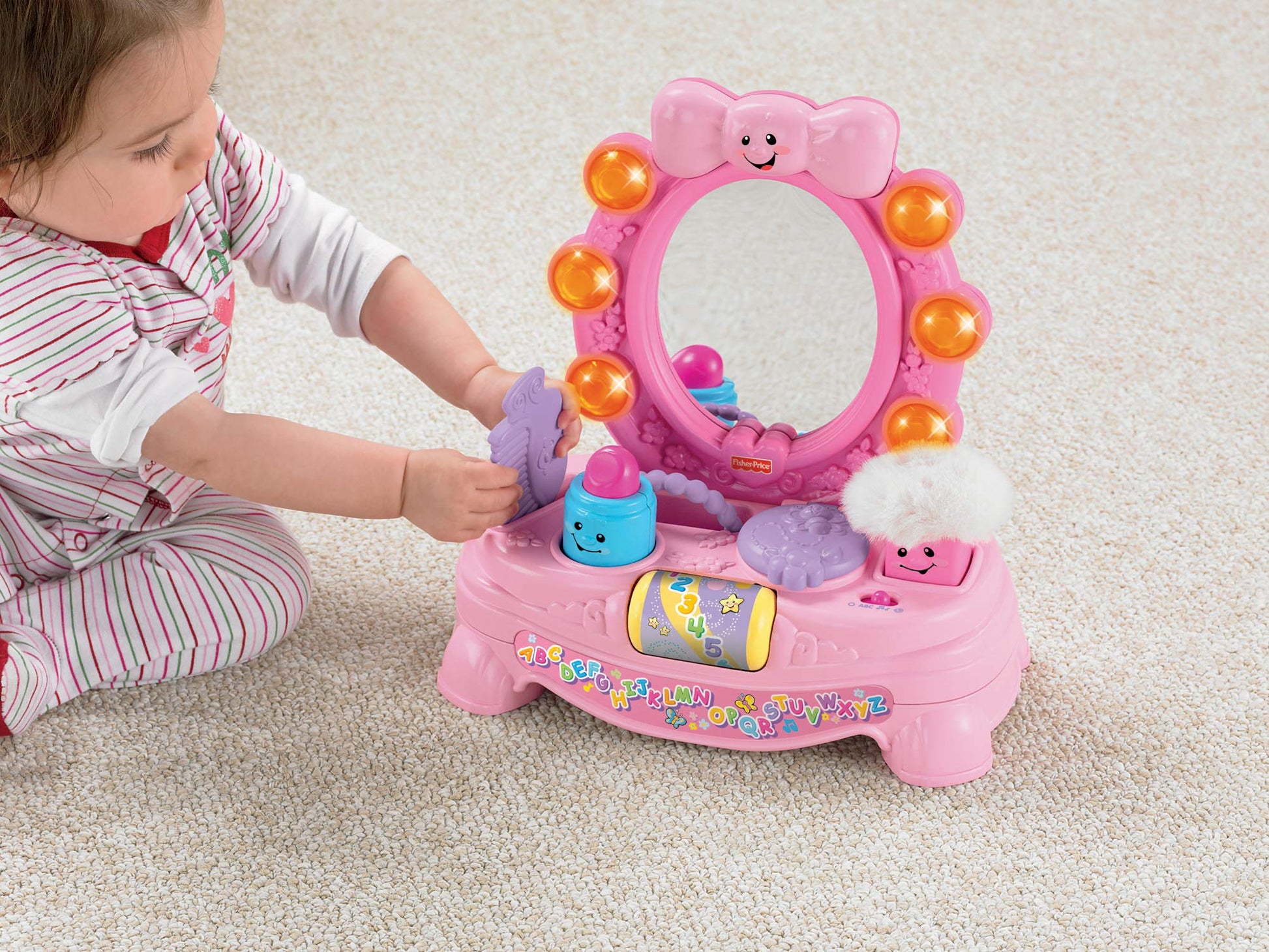 Fisher Price Laugh and Learn Magical Musical Mirror by Mattel with colorful interactive features and smiling face on the mirror.